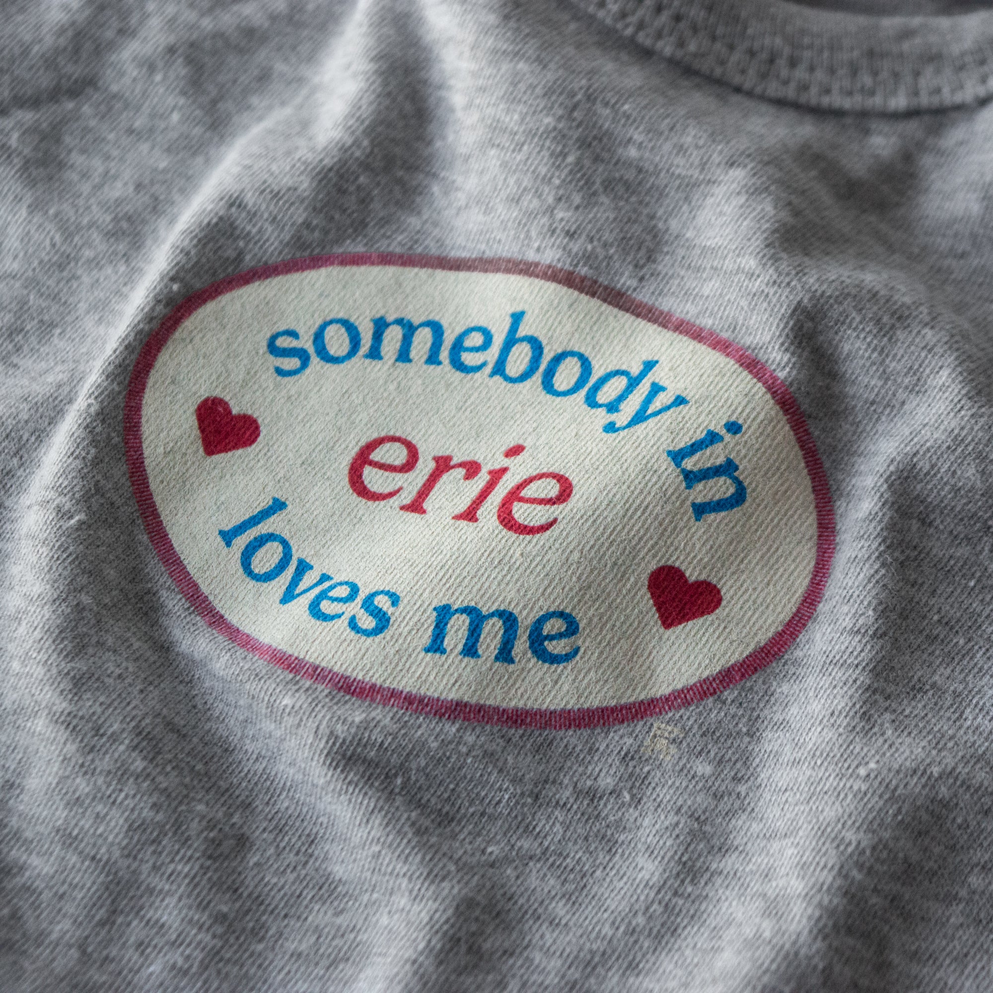 Somebody in Erie Loves Me Onesie